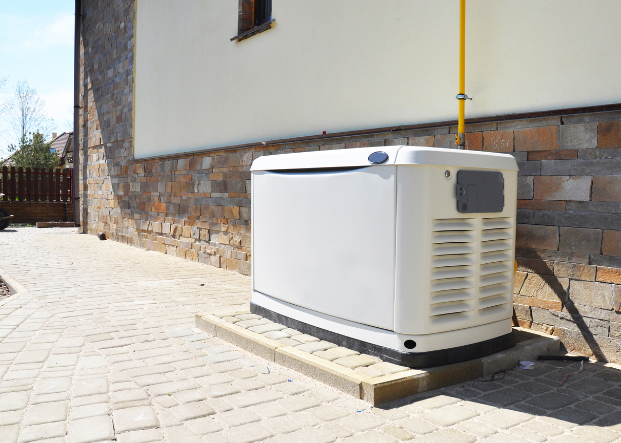 Generator on stone patio outside a Michigan home