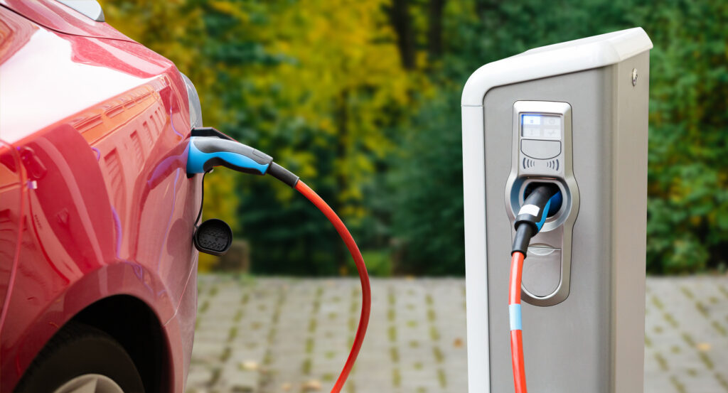 Close up of a charging electric car. Copy space