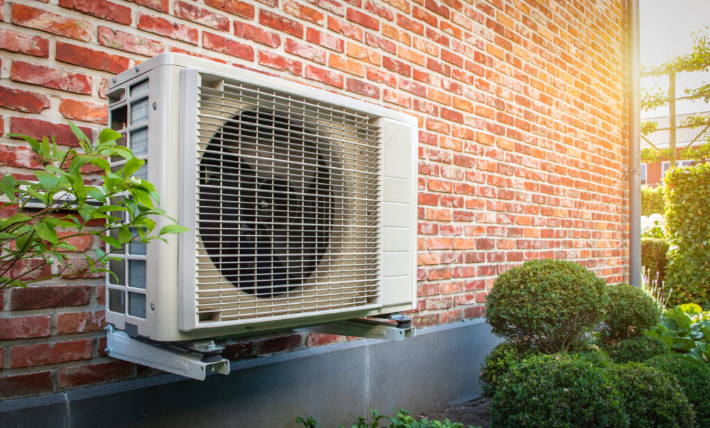 Newly installed heat pump mounted outside a home in Michigan