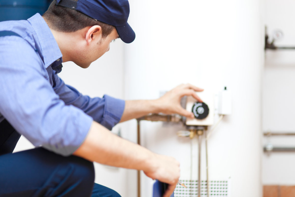 Hager Fox plumber installing a water heater in a residence