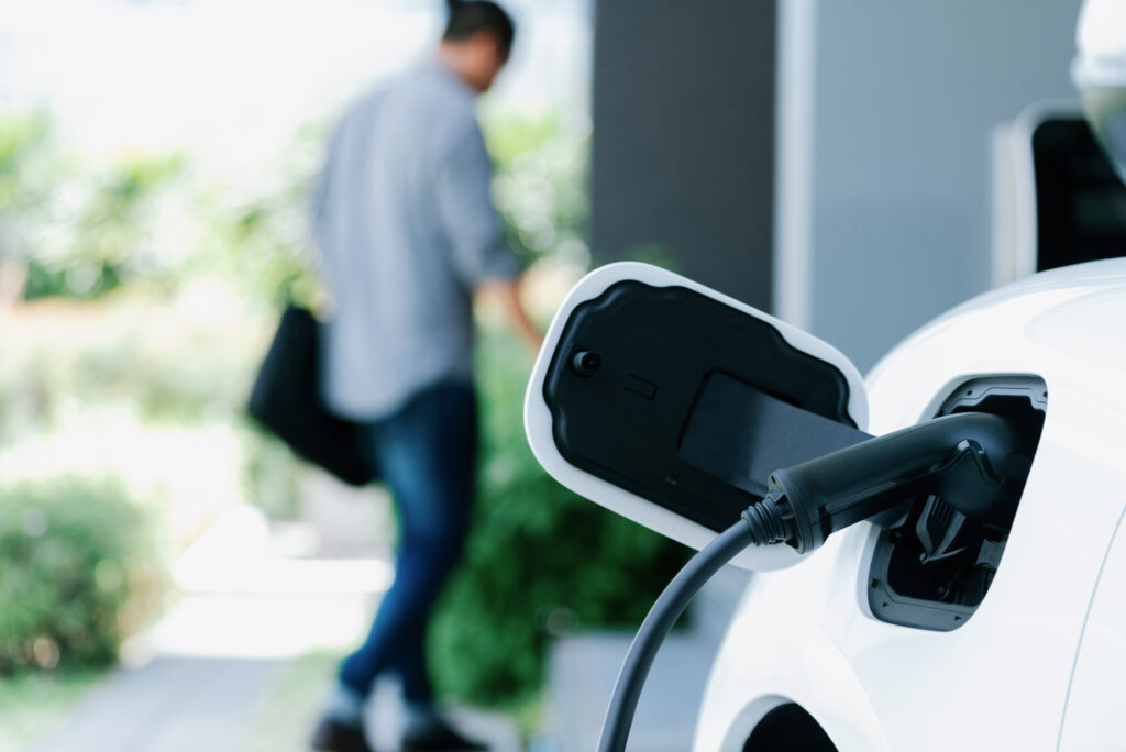 Closeup of EV charging at home in driveway